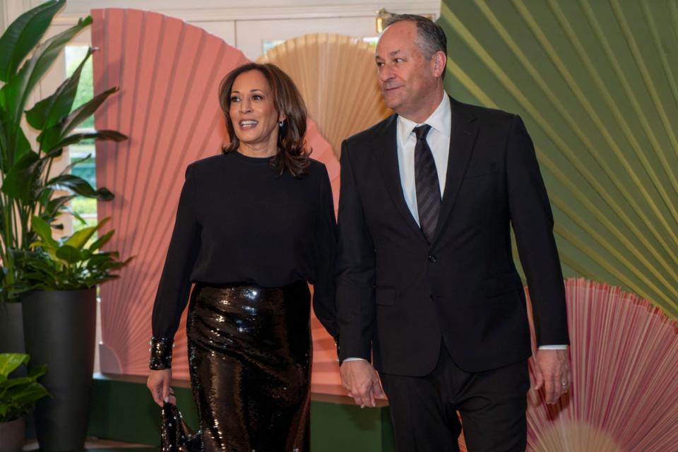 Harris and her husband, second gentleman Doug Emhoff, arrive for a state dinner earlier this year (Reuters)