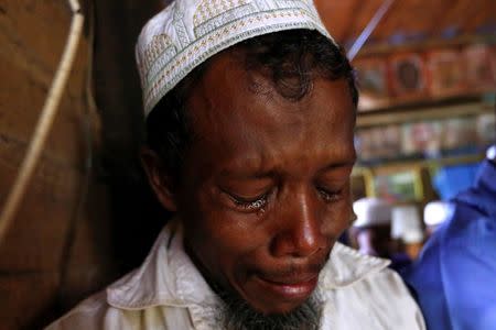 A muslim man cries after a group of men destroyed a mosque in the first serious outburst of inter-religious violence in months in the village of Thayethamin outside Yangon, Myanmar June 24, 2016. REUTERS/Soe Zeya Tun