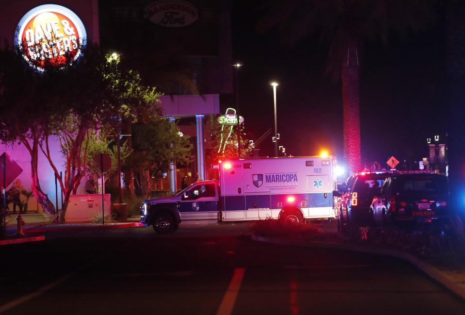 An ambulance drives through the Westgate Entertainment District in Glendale on May 20, 2020. At least three people were shot on Wednesday, according to Glendale police. Police said at least one person was in custody in connection with the shooting.