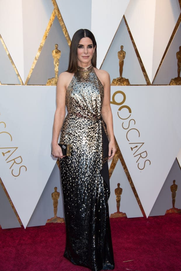 <p>Bullock was appropriately statuesque in a shimmering Louis Vuitton gown for the 2018 Oscars. She presented the award for Cinematography to Roger A. Deakins for his work on <em>Blade Runner 2049</em>.</p>