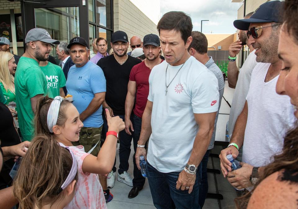 Actor Mark Wahlberg and his brother chef Paul visited the metro area on Monday for the grand opening of the new Wahlburgers in Royal Oak which benefitted Beaumont’s Children Miracle Network.