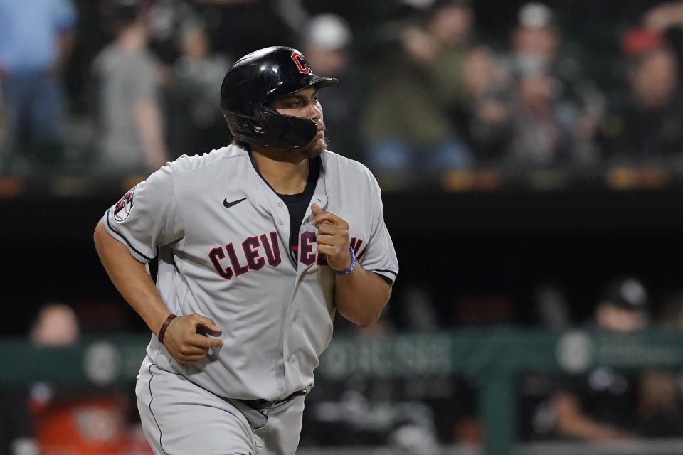 Cleveland Guardians' Josh Naylor watches his game-tying grand slam off Chicago White Sox relief pitcher Liam Hendriks during the ninth inning of a baseball game Monday, May 9, 2022, in Chicago. (AP Photo/Charles Rex Arbogast)