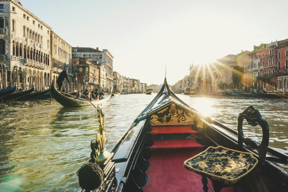 Check out how the iconic ambiance of Venice contributed to the filming of the series "Ripley".
pictured: a gondola in Venice during a bright sunny day on the water