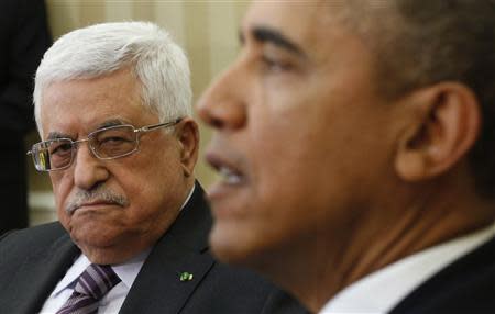 U.S. President Barack Obama meets with Palestinian Authority President Mahmoud Abbas (L) at the White House in Washington March 17, 2014. REUTERS/Kevin Lamarque