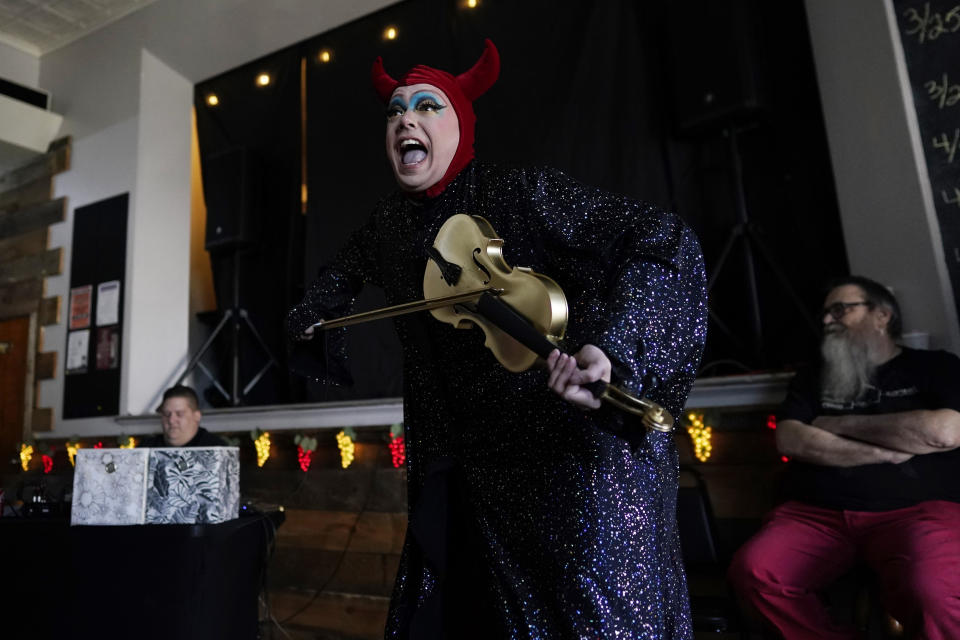 Trixy Valentine, aka Jacob Kelley, performs to "The Devil Went Down to Georgia" by the Charlie Daniels Band during the "Spring Fever Drag Brunch," Sunday, March 26, 2023, at the Kulpmont Winery in Kulpmont, Pa. Kelley is an LGBTQ+ activist and educator with a masters in human sexuality. (AP Photo/Carolyn Kaster)