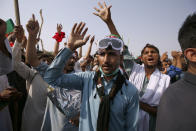 Supporters of ousted Pakistani Prime Minister Imran Khan chant slogans during in an anti-government rally, in Islamabad, Pakistan, Thursday, May 26, 2022. Defiant former Prime Minister Khan early Thursday warned Pakistan's government to set new elections in the next six days or he will again march on the capital along with 3 million people. (AP Photo/Anjum Naveed)