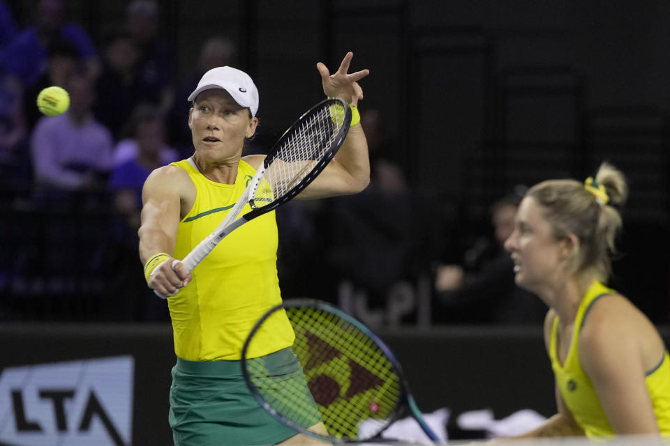 Storm Sanders, right, and Samantha Stosur of Australia return a ball during the semi-finals against Alicia Barnett and Olivia Nicholls of Great Britain, at the Billie Jean King Cup tennis finals at the Emirates Arena in Glasgow, Scotland, Saturday, Nov. 12, 2022. (AP Photo/Kin Cheung)