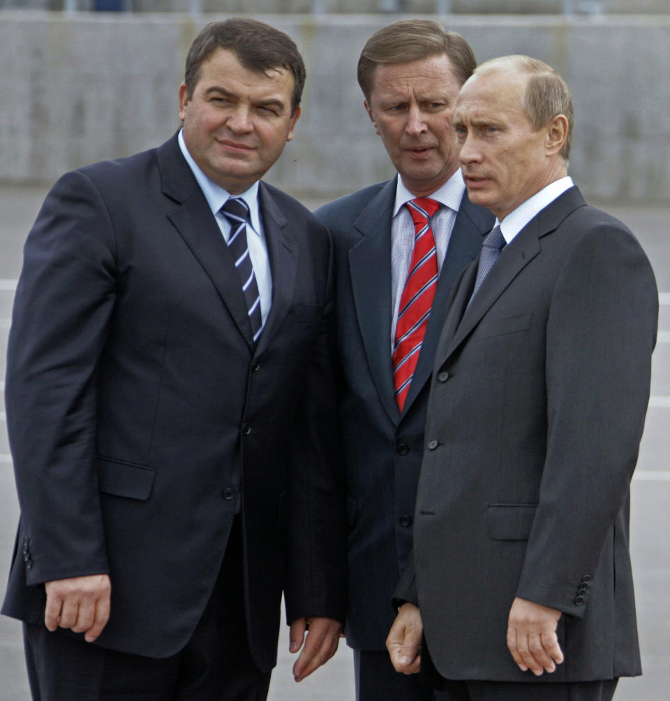 FILE - This Oct. 12, 2007 file photo shows from left : Russian Defense Minister Anatoly Serdyukov, Russian First Vice Premier Sergei Ivanov and President Vladimir Putin speaking during a visit to Vilyuchinsk submarine base at the Kamchatka Peninsula at Russian Far East. Russian President Vladimir Putin, right, listens to Kremlin's Chief of Staff Sergei Ivanov during a meeting at the Novo-Ogaryovo residence outside Moscow. Ivanov said Sunday Nov. 11, 2012 he was aware of alleged embezzlement of state funds by officials in a company developing Russia's satellite navigation system for several years, but didn't speak publicly about it for several years to prevent the culprits from covering up their deeds. (AP Photo/RIA Novosti, Mikhail Klimentyev, Presidential Press Service)