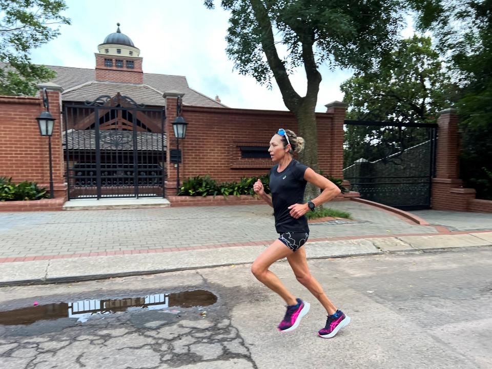 A woman jogs past the house of Oscar Pistorius' uncle Arnold, ahead of Oscar Pistorius' expected release from prison, in Pretoria, South Africa (Reuters)