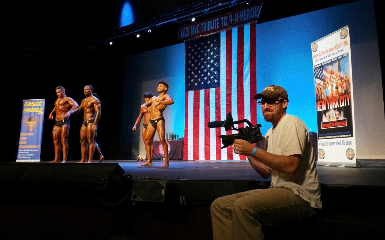 John Wilson attending a 9/11 themed body building contest in season 3 of his HBO show