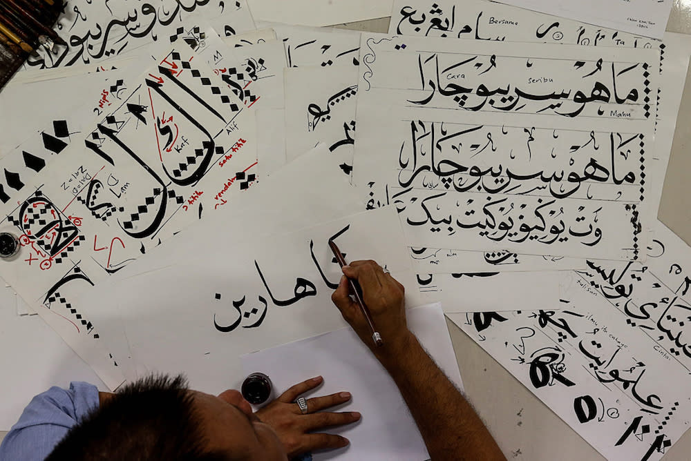 A man practises khat calligraphy in Balik Pulau, Penang August 6, 2019. — Picture by Sayuti Zainudin