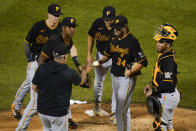 Pittsburgh Pirates starting pitcher JT Brubaker (34) hands the ball to manager Derek Shelton during the sixth inning of a baseball game against the New York Mets, Friday, July 9, 2021, in New York. (AP Photo/Frank Franklin II)