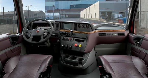 Spacious interior of International brand truck cab.