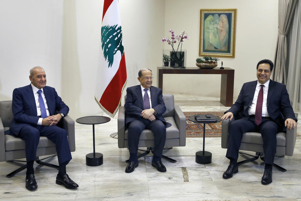 Lebanese President Michel Aoun, center, meets with Prime Minister-designate Hassan Diab, right, and Parliament Speaker Nabih Berri, left, at the Presidential Palace in Baabda, east of Beirut, Lebanon, Tuesday, Jan. 21, 2020. (AP Photo/Bilal Hussein)