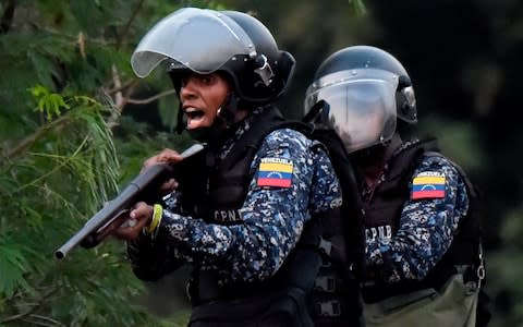 Venezuelan security forces clash with supporters of Venezuelan opposition leader Juan Guaido on the Venezuelan side f the Francisco de Paula Santander International Bridge - Credit: RAUL ARBOLEDA/AFP