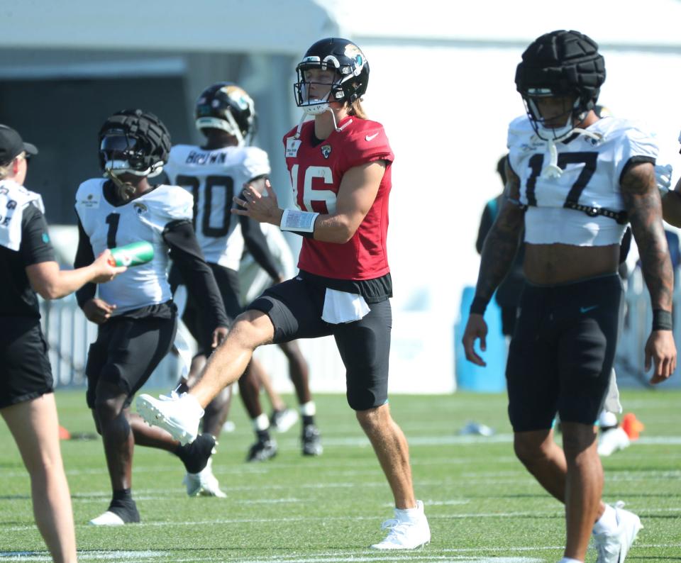 Jaguars quarterback Trevor Lawrence stretches before the Lions' joint practice with the Jaguars on Wednesday, Aug. 16, 2023, in Allen Park.
