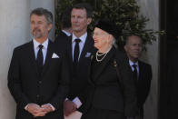 Denmark's Crown Prince Frederik, left, and Queen Margrethe II of Denmark stand outside of the Metropolitan Cathedral during the funeral of former king of Greece Constantine II in Athens, Monday, Jan. 16, 2023. Constantine died in a hospital late Tuesday at the age of 82 as Greece's monarchy was definitively abolished in a referendum in December 1974. (AP Photo/Petros Giannakouris)