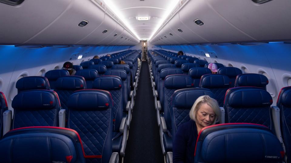 Atlanta, USA - March 21, 2020: Delta Airlines flight 0958, from Atlanta to Melbourne, FL, prepares to depart with only a handful of passengers on board due to the spreading coronavirus pandemic.