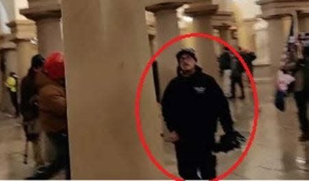 A photo in the criminal complaint filed against David Ball, of Wells, Maine, shows Ball inside the U.S. Capitol on Jan. 6, 2021, the day rioters entered the building and disrupted Congress as it worked to certify the results of the 2020 presidential election.