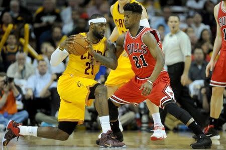 May 6, 2015; Cleveland, OH, USA; Cleveland Cavaliers forward LeBron James (23) works against Chicago Bulls guard Jimmy Butler (21) during the first quarter in game two of the second round of the NBA Playoffs at Quicken Loans Arena. Mandatory Credit: Ken Blaze-USA TODAY Sports