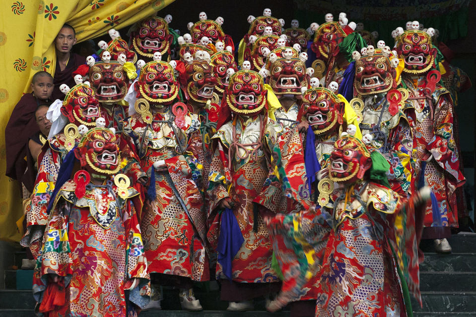 Buddhist monks perform cham