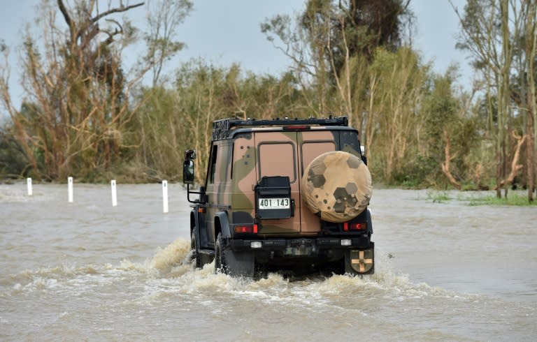 The wild weather caused by Cyclone Debbie has made the clean-up difficult as crews battle horrendous conditions to reach isolated communities and restore power