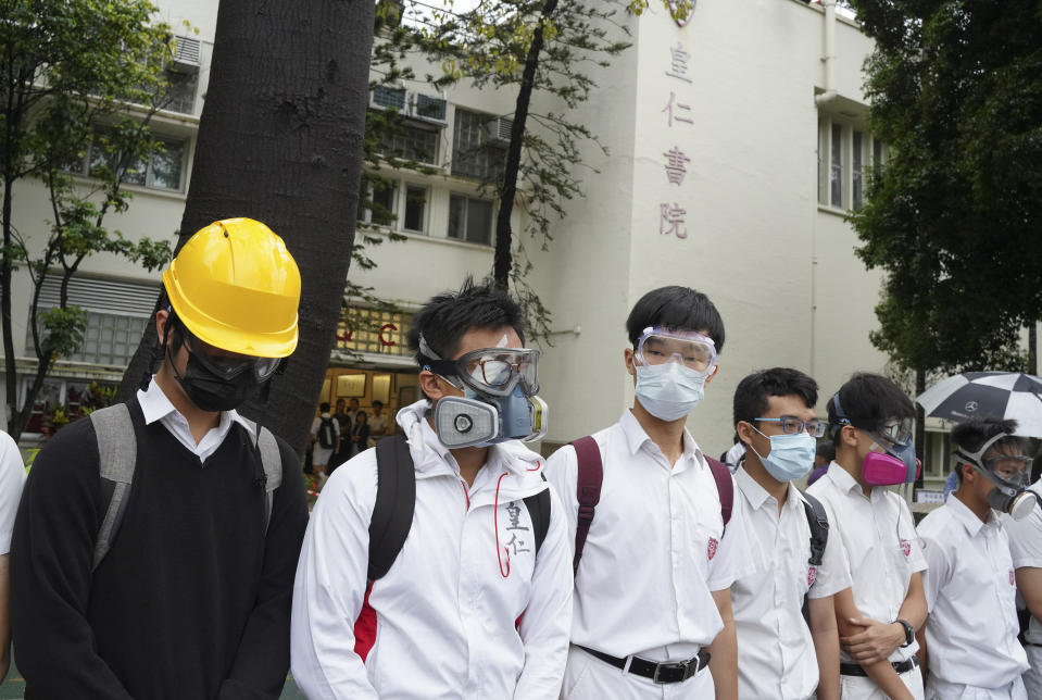 Students wearing gas masks and helmets gather outside Queen's College during a protests in Hong Kong, on Monday, Sept. 2, 2019. Hong Kong has been the scene of tense anti-government protests for nearly three months. The demonstrations began in response to a proposed extradition law and have expanded to include other grievances and demands for democracy in the semiautonomous Chinese territory. (AP Photo)