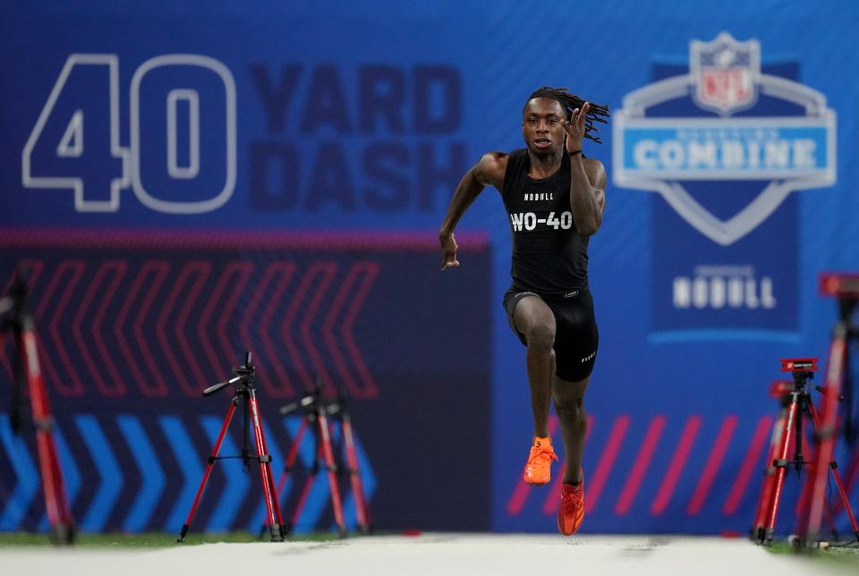 Mar 2, 2024; Indianapolis, IN, USA; Texas wide receiver Xavier Worthy (WO40) ran an official time of 4.21 seconds to set a combine record during the 2024 NFL Combine at Lucas Oil Stadium. Mandatory Credit: Kirby Lee-USA TODAY Sports