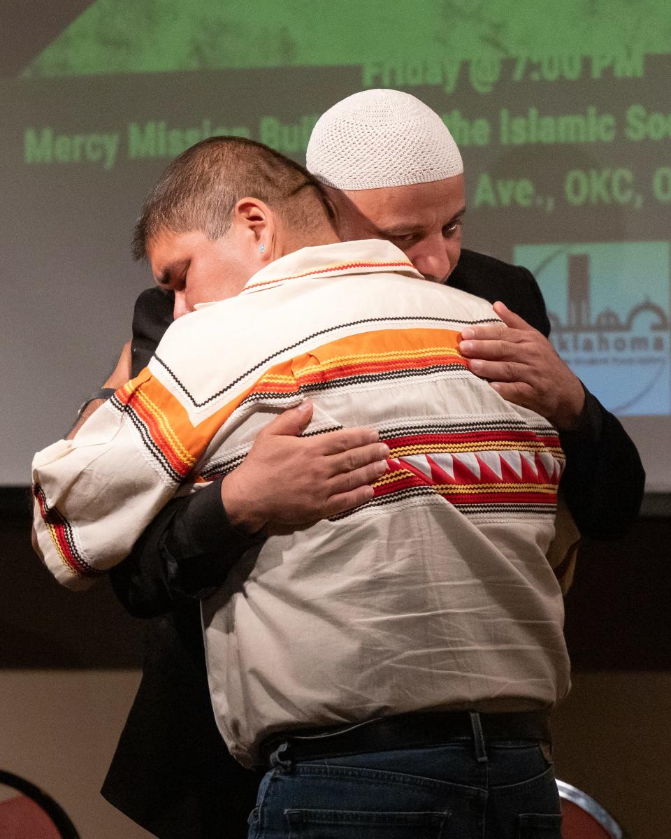 The Rev. Chebon Kernell, left, is embraced by Imam Imad Enchassi during "Stories from Gaza and Prayers for Palestine" event at the Islamic Society of Greater Oklahoma City's Mercy Mission Building.