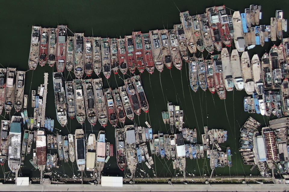 In this photo released by Xinhua News Agency, this aerial photo shows fishing boats taking shelter at a harbor as Typhoon Doksuri approaches the city of Chaozhou in southern China's Guangdong Province, Thursday, July 27, 2023. Typhoon Doksuri is expected to make landfall in China after bringing deadly landslides to the Philippines. (Wang Ruiping/Xinhua via AP)
