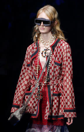 A model displays a creation from the Gucci Spring/Summer 2018 show at the Milan Fashion Week in Milan, Italy, September 20, 2017. REUTERS/Stefano Rellandini