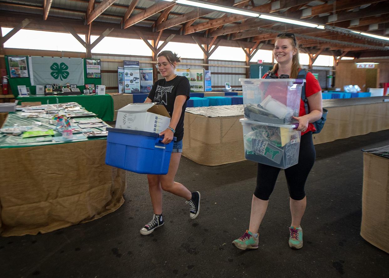 Brining in supplies for the Bucks County 4-H exhibits are Lauren Rowlands, left, of Richboror, a 4-H Summer program assistant, and Sarah Gregory, of Doylestown, Bucks County 4-H Educator, during preparations for the upcoming Middletown Grange Fair in Wrightstown, on Monday, Aug. 15, 2022.