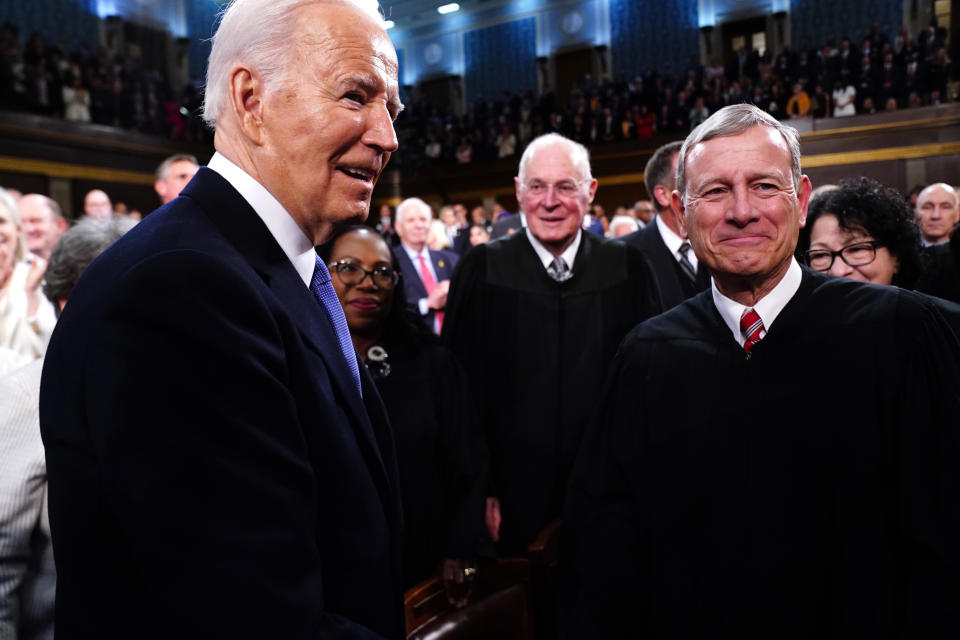 WASHINGTON, DC - MARCH 7: U.S. President Joe Biden greets Supreme Court Chief Justice John Roberts as Biden enters the House chamber to deliver the annual State of the Union address before a joint session of Congress at the Capital building on March 7, 2024 in Washington, DC. This is Biden's final address before the November general election. (Photo by Shawn Thew-Pool/Getty Images)