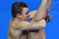 Troy Dumais of the U.S. performs a dive during the men's 3m springboard preliminary round at the London 2012 Olympic Games at the Aquatics Centre August 6, 2012. REUTERS/Toby Melville (BRITAIN - Tags: SPORT DIVING OLYMPICS SPORT SWIMMING) 