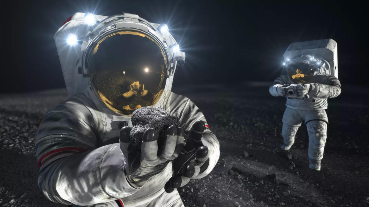  Illustration of two astronauts in white spacesuits walking on the moon. 