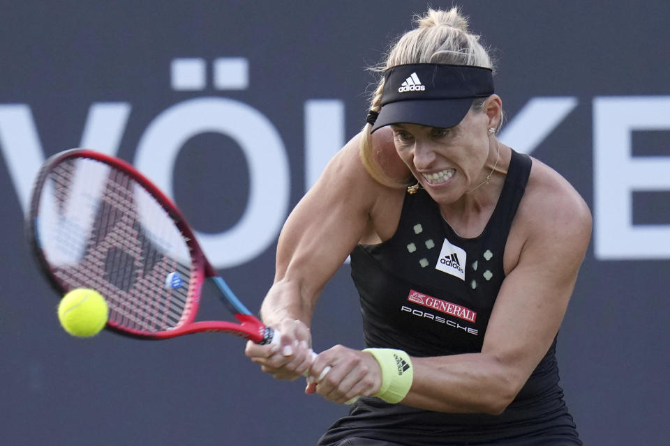 Germany's Angelique Kerber returns a ball to Russia's Anastasia Gasanova during the WTA Tour women's singles match in Bad Homburg, Germany, Monday June 20 2022. (Thomas Frey/dpa via AP)