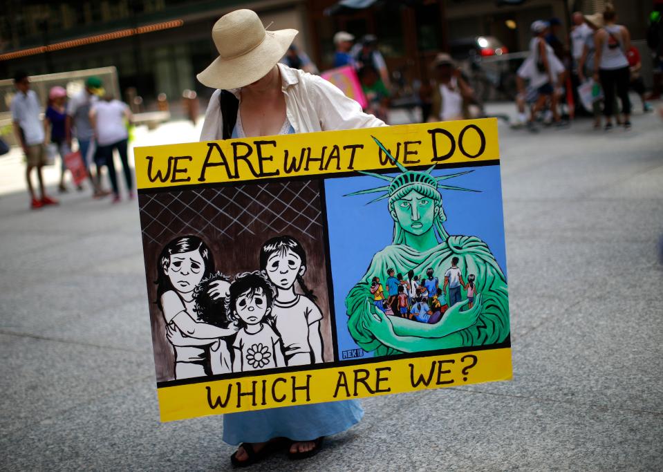 <p>A woman takes part in a protest against the US immigration policies separating migrant families in Chicago, June 30, 2018. (Photo: Jim Young/AFP/Getty Images) </p>