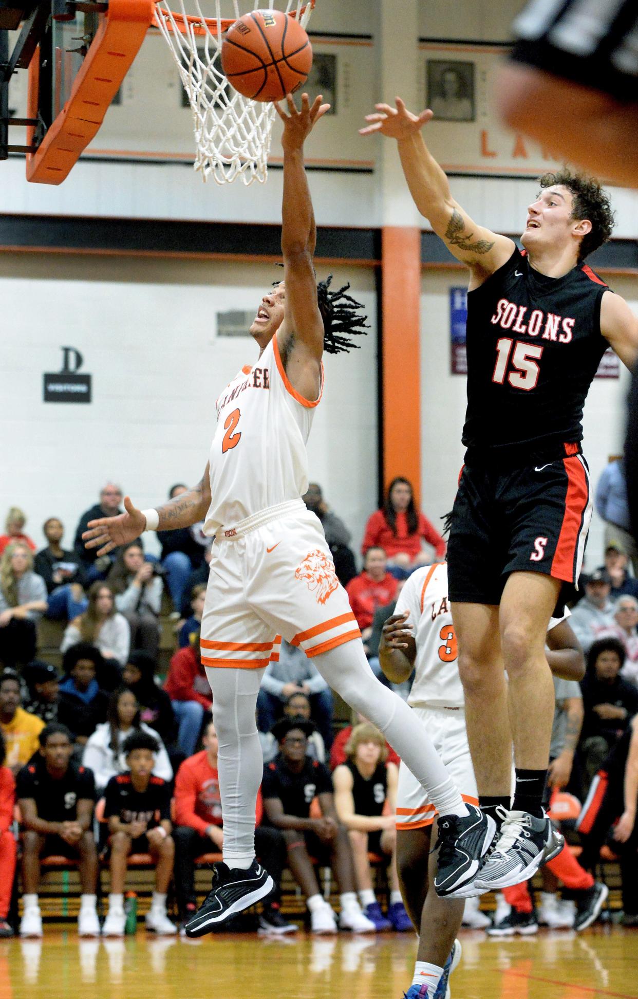 Lanphier's. Jessie Bates III goes up for a shot while being guarded by Springfield's Paul Hartman during the game Friday, Dec. 8, 2023.