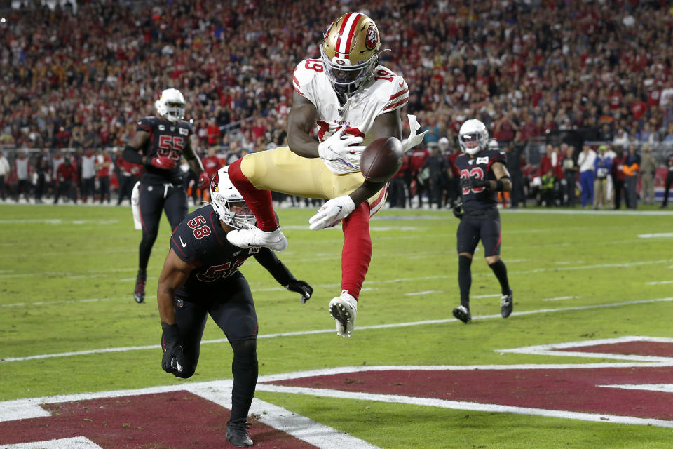San Francisco 49ers wide receiver Deebo Samuel can't make the catch as Arizona Cardinals middle linebacker Jordan Hicks (58) defends during the first half of an NFL football game, Thursday, Oct. 31, 2019, in Glendale, Ariz. (AP Photo/Rick Scuteri)