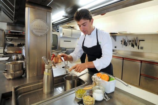 French two-star Michelin chef Jean Sulpice, seen here cooking in the kitchen of his L'Oxalys restaurant, in Europe's highest ski resort of Val-Thorens, 2,300 meters up in the French Alps