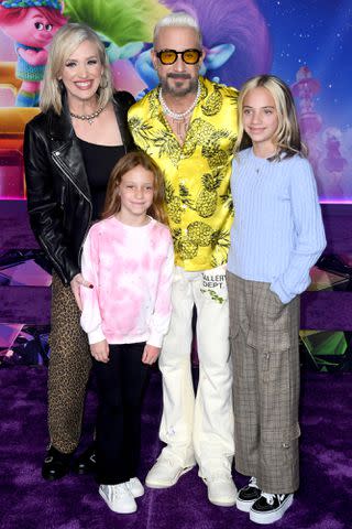 <p>Albert L. Ortega/Getty</p> AJ and Rochelle McLean with their daughters.