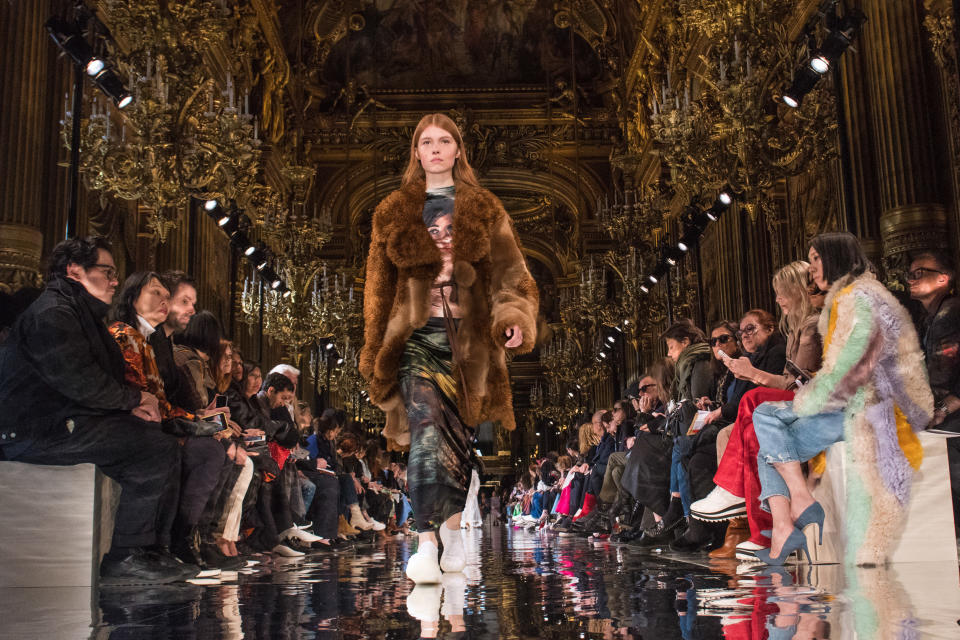 A model wears a faux fur coat on the runway at Stella McCartney's fall/winter 2018 show.  (Peter White via Getty Images)