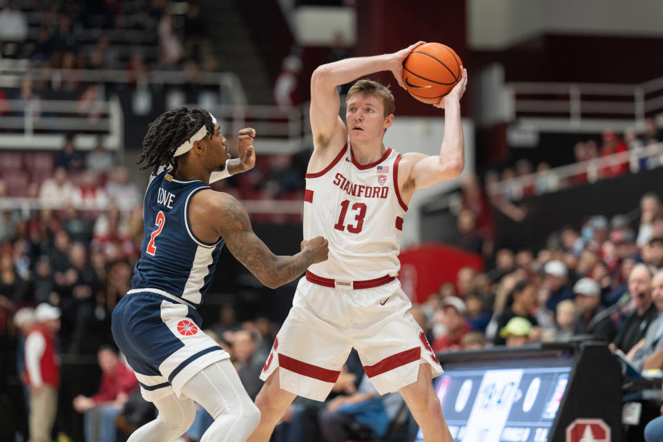 Stanford Cardinal guard Michael Jones (13) looks to pass the ball during the first half against Arizona Wildcats guard Caleb Love (2) at Maples Pavilion in Stanford, California, on Dec. 31, 2023.