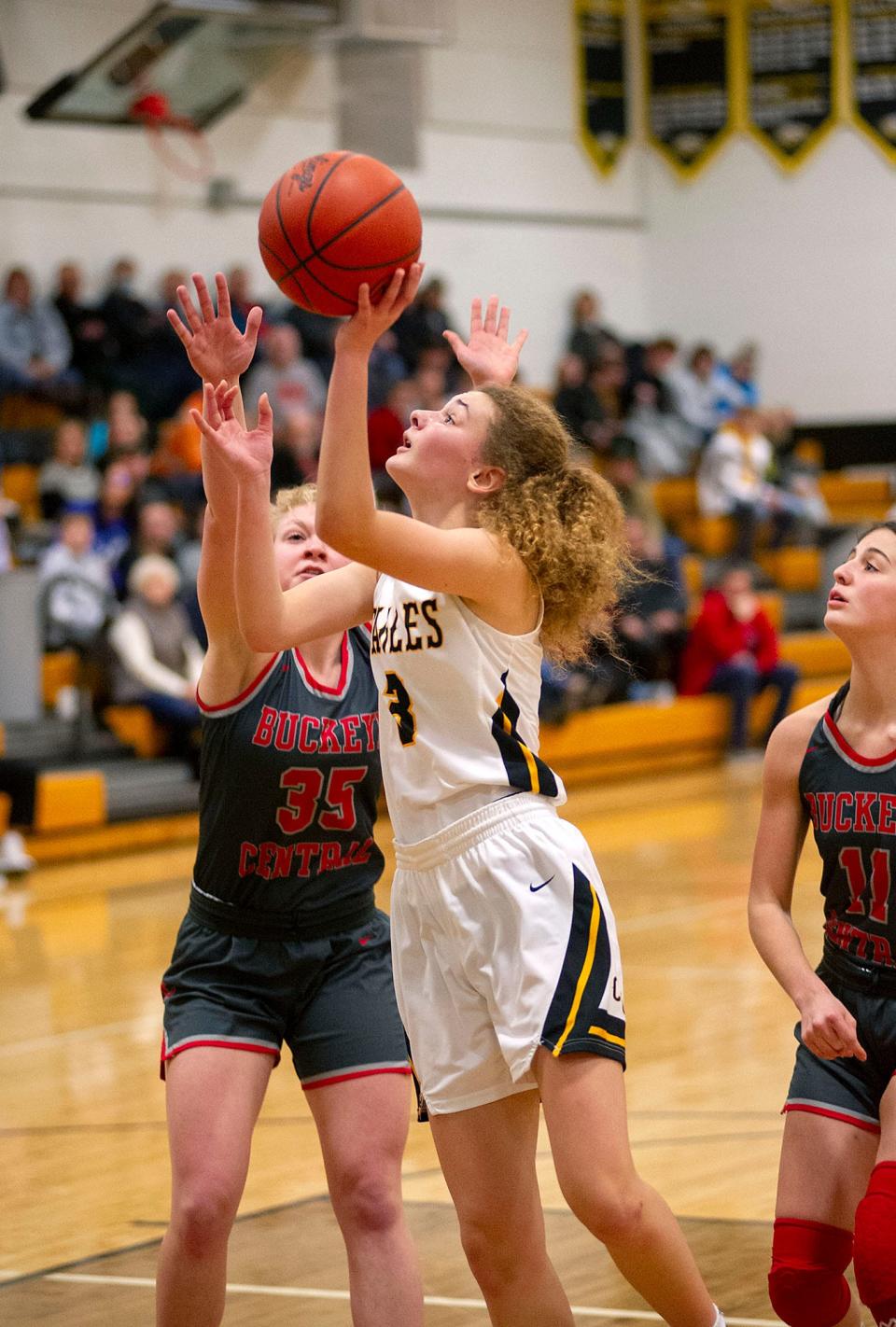 Colonel Crawford's Mallory Plesac finishes at the basket.