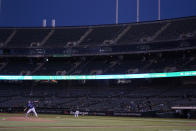 Seattle Mariners' Chris Flexen, bottom left, pitches against the Oakland Athletics during the second inning of a baseball game in Oakland, Calif., Wednesday, Sept. 22, 2021. (AP Photo/Jeff Chiu)