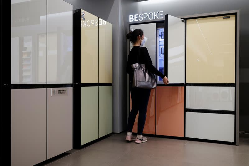 A woman looks around Samsung Electronics' BESPOKE refrigerators on display at its store in Seoul