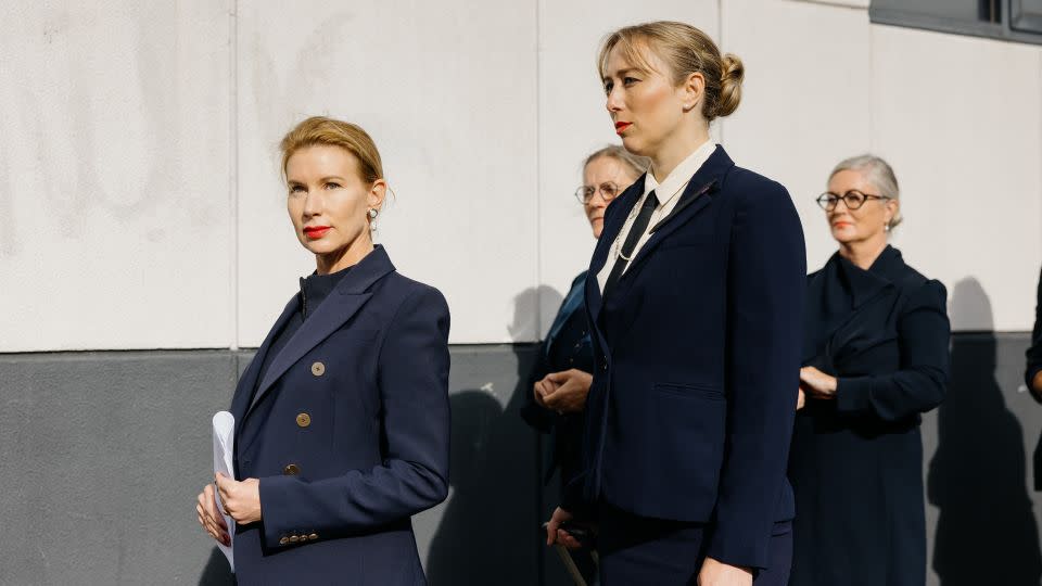 Kaechele (left) and her navy-clad entourage outside the tribunal earlier this year. - Charlotte Vignau