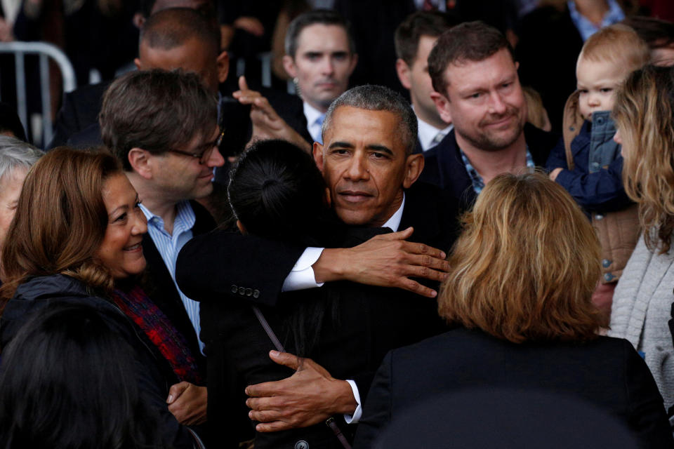 FILE PHOTO - Former president Barack Obama embraces a staff member before boarding Special Air Mission 28000, a Boeing 747 which serves as Air Force One, at Joint Base Andrews, Maryland, U.S. on January 20, 2017. REUTERS/Brendan McDermid/File Photo