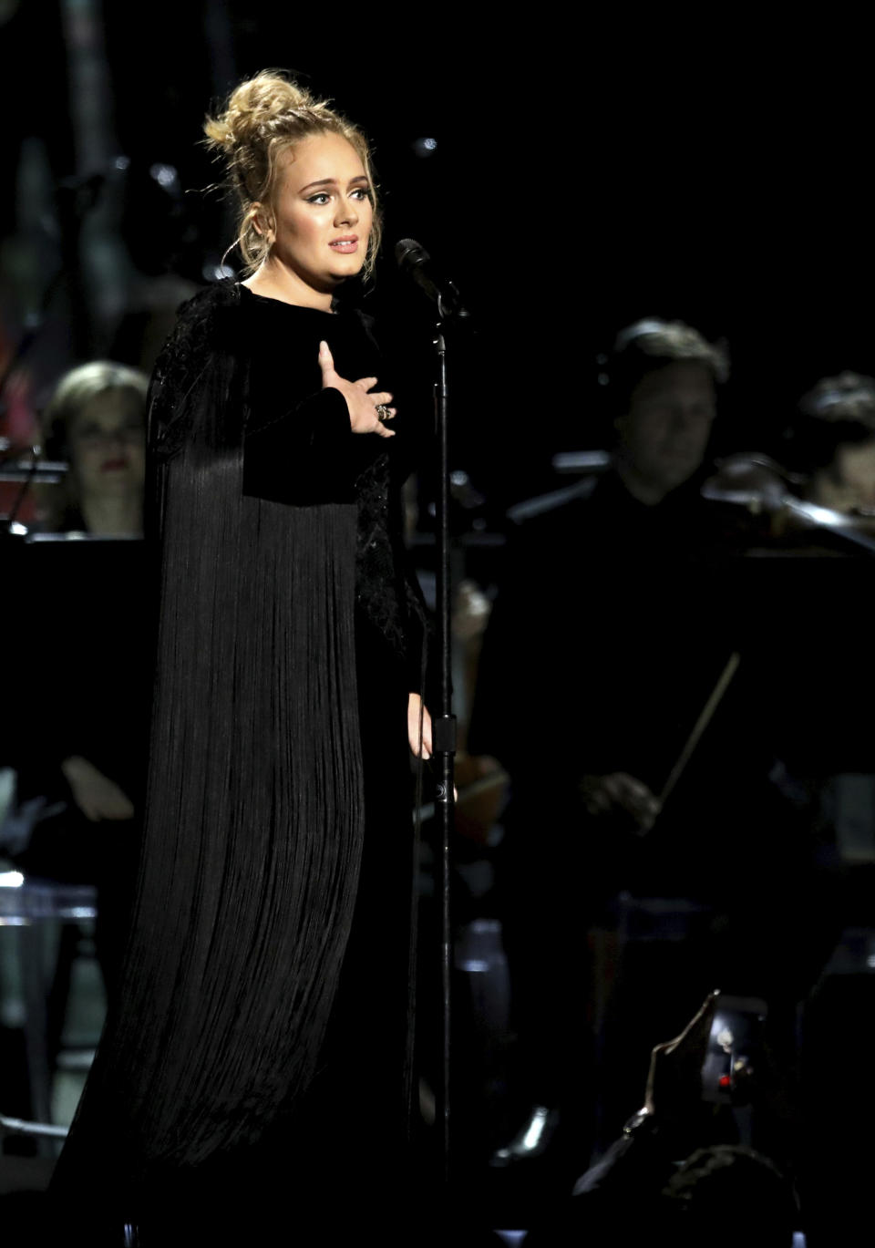 Adele apologizes before restarting a performance tribute to George Michael at the 59th annual Grammy Awards on Sunday, Feb. 12, 2017, in Los Angeles. (Photo by Matt Sayles/Invision/AP)