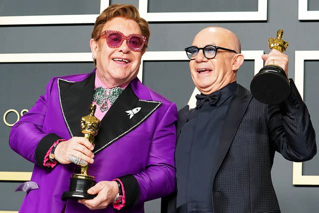 <p>Rachel Luna/Getty</p> Elton John and Bernie Taupin at the 92nd Annual Academy Awards